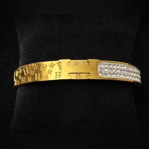 New Gold Tone Hinged Bangle Bracelet with Crystal Accent Panel & Textured Letter